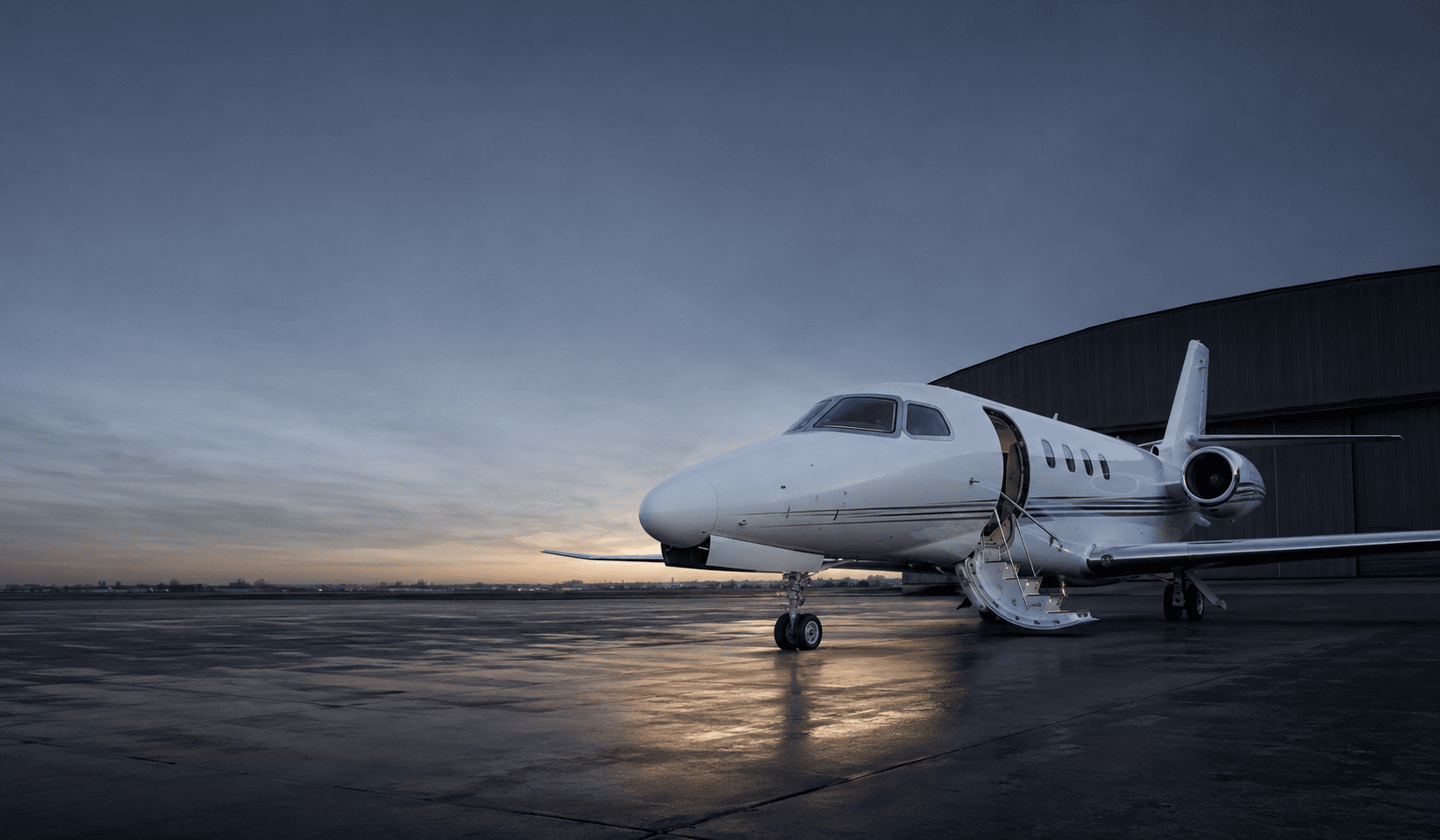 Aircraft on the ramp at dawn, airstair down
